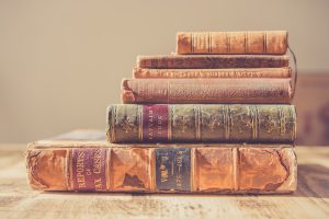 short fiction versus long: stack of vintage books