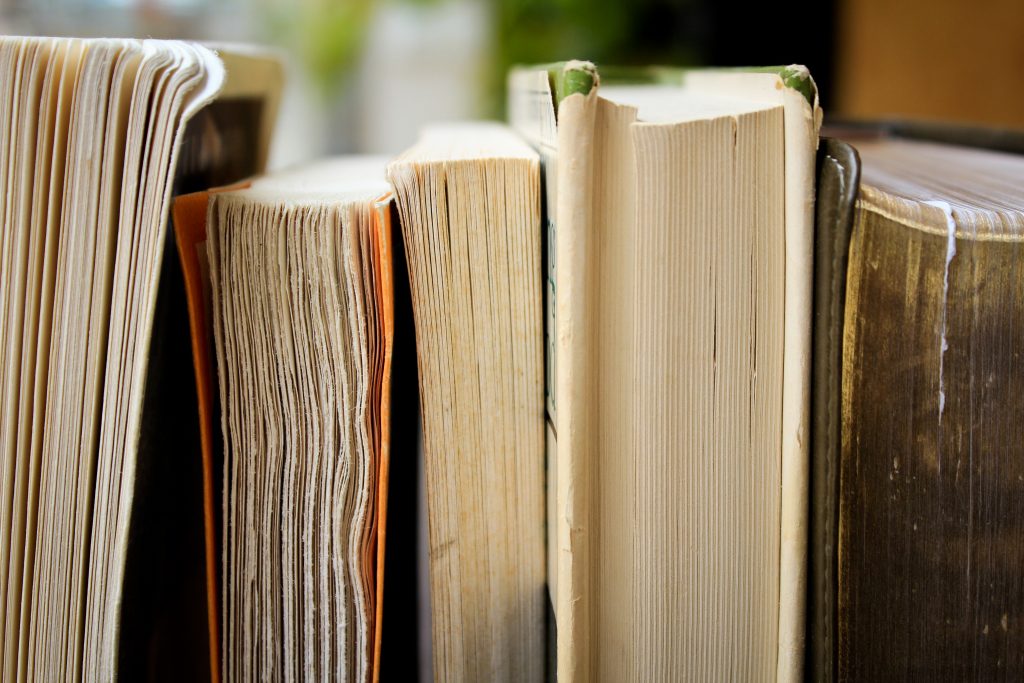 short fiction versus long: books lined up, cut pages facing out