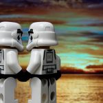 two lego storm troopers holding hands